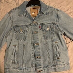 Women’s Levi’s ex-boyfriend, trucker jacket, size medium, light wash. NWT.